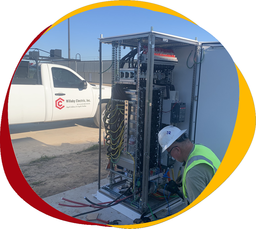 Willaby Electric, Inc. technician installing an electrical panel